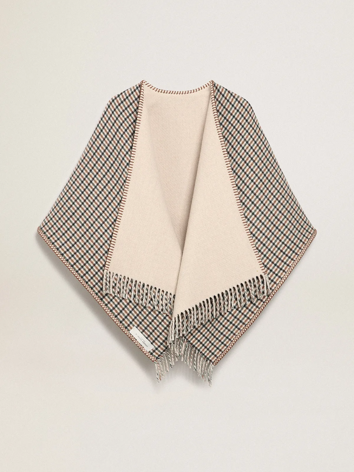 Poncho in double face cream-colored wool with check pattern and lettering