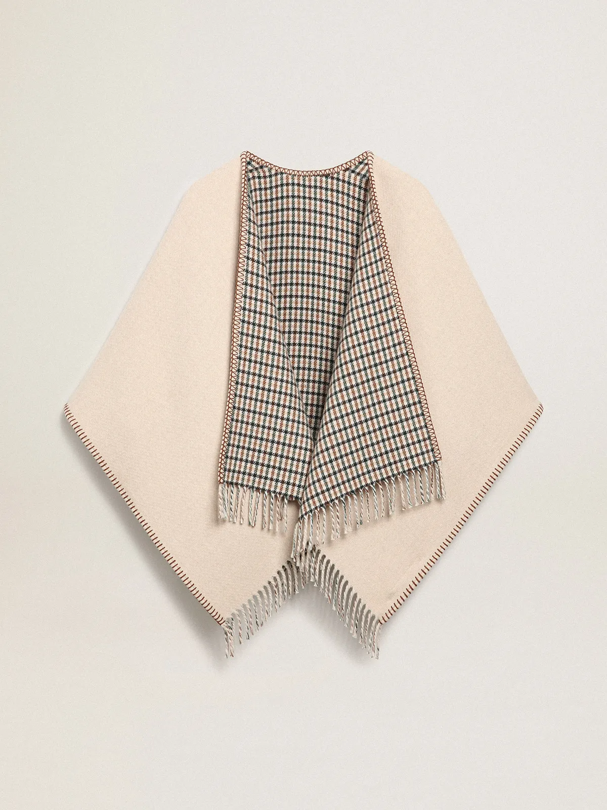 Poncho in double face cream-colored wool with check pattern and lettering